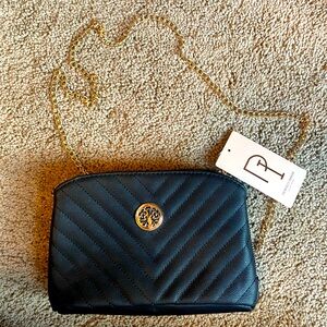 New with tags black purse. Gold chain
